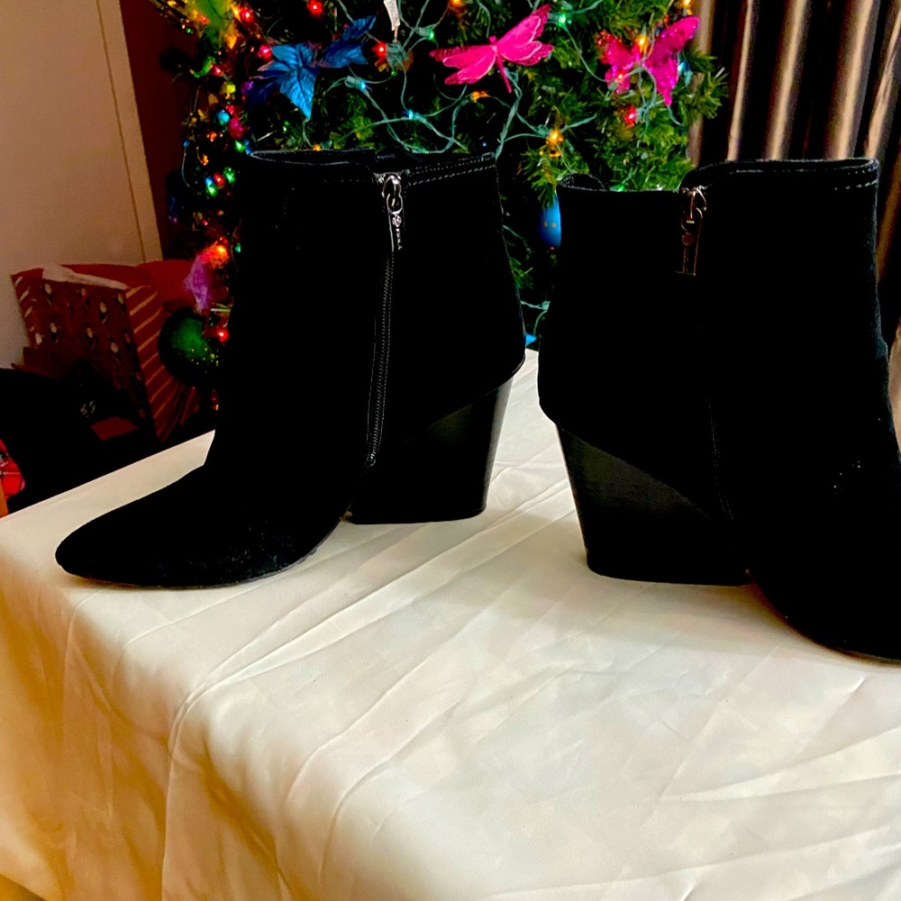 Isola Black Suede Bootie w/cute tassel strips on side. Creative heel. Good shape